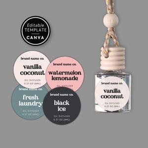 May include: A clear glass oil diffuser bottle with a wooden cap and hanging cord, accompanied by four circular labels featuring the text brand name co. and scents including vanilla coconut, watermelon lemonade, fresh laundry, and black ice.