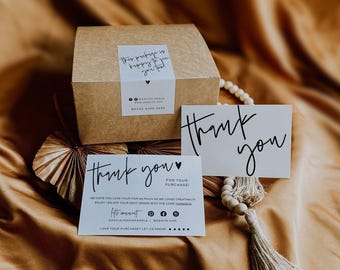 May include: A brown cardboard box with a white sticker reading This package is happy to see you too, accompanied by two white thank you cards with black text, social media icons, and a wooden bead garland with a beige tassel.