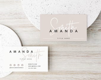 May include: Two rectangular business cards featuring a beige card with white script text reading Smith and black sans-serif text reading AMANDA and TITLE HERE, and a white card with black text reading AMANDA, Smith, TITLE HERE, and contact details.