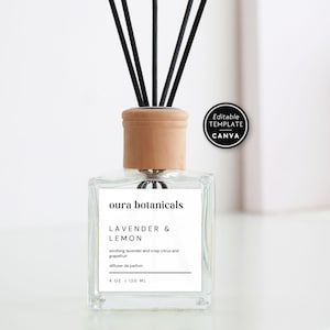 May include: A clear glass reed diffuser bottle with a light wood cap and black reeds. The white label reads oura botanicals, LAVENDER & LEMON, soothing lavender and crisp citrus and grapefruit, diffuser de parfum, 4 OZ. | 120 ML.