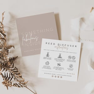 May include: Two square cards with white and taupe backgrounds. The taupe card reads SOMETHING fabulous INSIDE. The white card features REED DIFFUSER instructions with six black icons and text detailing usage, safety, and social media placeholders.
