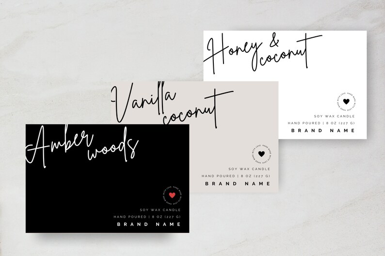 May include: Three black and white labels for soy wax candles. The labels feature handwritten text with the names "Honey & Coconut", "Vanilla Coconut", and "Amber Woods". Each label includes the text "Soy Wax Candle", "Hand Poured", and "Brand Name".