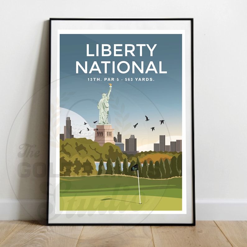 May include: A poster with a blue, green, and brown color scheme featuring a golf course with a green putting green and a flag. The poster has the text "LIBERTY NATIONAL" and "13TH. PAR 5 - 563 YARDS." The poster also features a cityscape with the Statue of Liberty in the background.