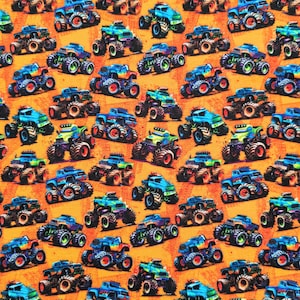 May include: A repeating pattern of colorful monster trucks on an orange background. The trucks are in various colors, including blue, green, and red, with large tires and detailed designs. The overall theme is playful and energetic.