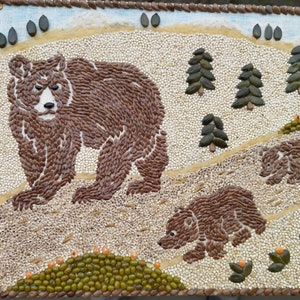 The caring mother bear with little bears