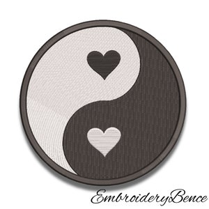 May include: Black and white yin yang symbol with a black heart on the white side and a white heart on the black side.