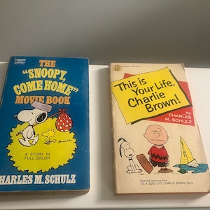 2 vintage-Charles M. Shultz books-Charlie Brown-snoopy-snoopy come home, movie book-This is your life, Charlie Brown! 60s-70s