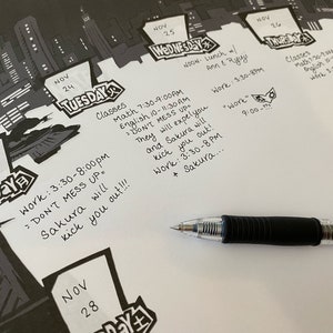 May include: A close-up of a calendar with handwritten notes for the month of November. The notes include class schedules, work hours, and reminders. The text includes "Don't mess up" and "Sakura will kick you out!"