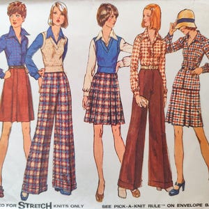 May include: A vintage sewing pattern for a women's clothing set. The pattern includes four different looks featuring plaid and solid fabrics. The pattern is for size 12 with a bust measurement of 86 cm.