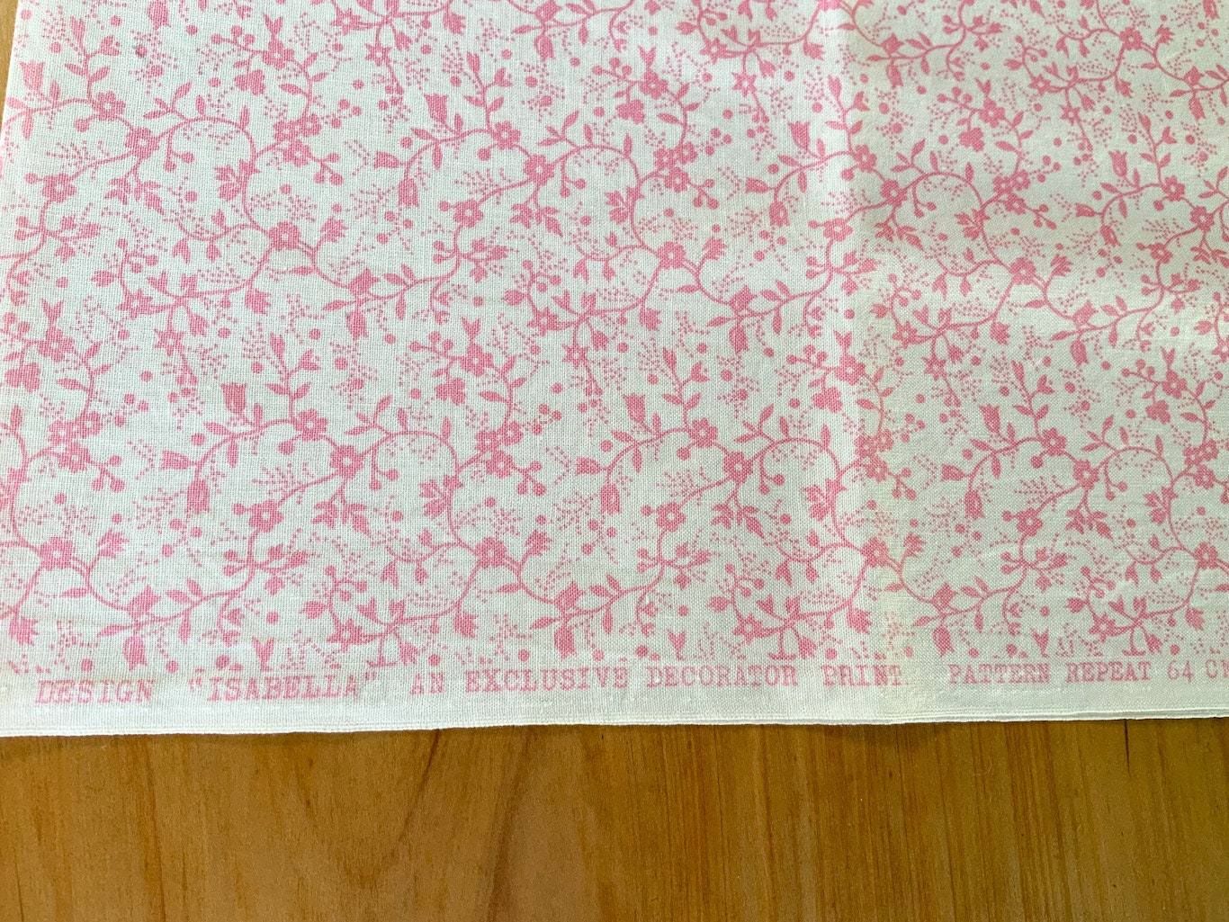 Quilting cotton small pink floral on warm white plain weave fabric 1.1m