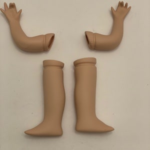 Par de brazos y piernas de muñeca vintage y vestido
