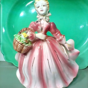 Beautiful figurine with flower holder 6-1/2 in.tall