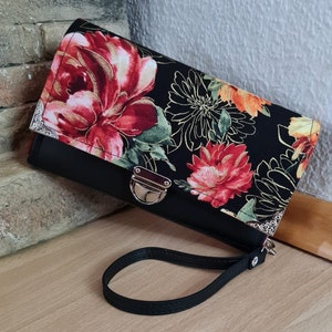 Una cartera XL con compartimento para fotografías.