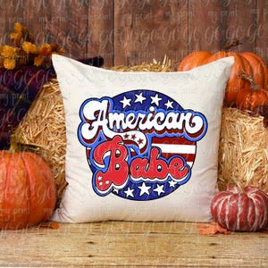 Retro American Babe red white and blue design shown on a white decorative pillow.