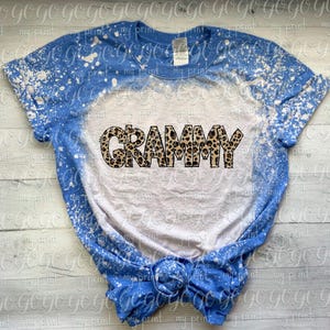 Grammy leopard print design shown on a blue and white bleached T-shirt mockup.