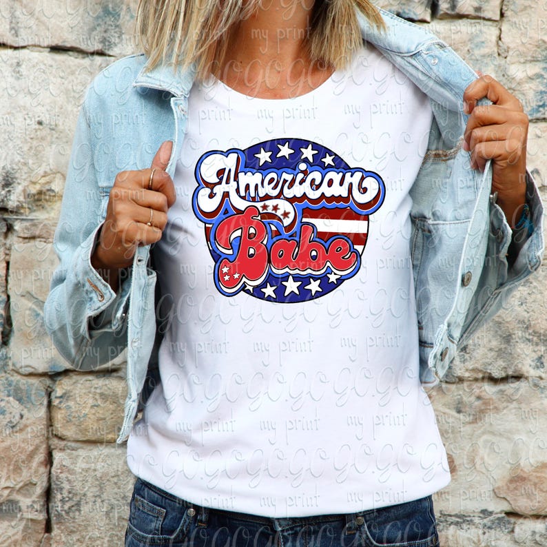 Woman wearing a white shirt featuring the retro American Babe red white and blue patriotic design.