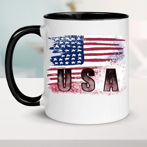 Distressed American flag and USA lettering shown on a white mug mockup.