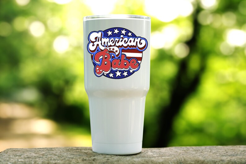 American Babe stars and stripes retro patriotic design shown on a white tumbler.