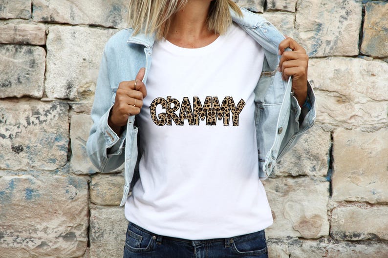 Woman wearing a white shirt featuring the Grammy leopard print hand drawn lettering design.