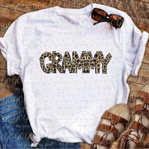 Grammy leopard print lettering displayed on a white T-shirt mockup with bold hand drawn animal print design.