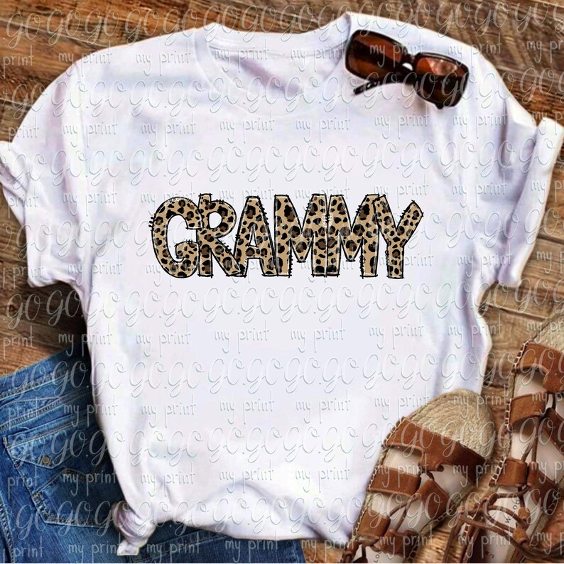 Grammy leopard print lettering displayed on a white T-shirt mockup with bold hand drawn animal print design.