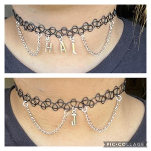 May include: Two black choker necklaces with silver chains and letter charms. The top necklace has the letters "HAI" and the bottom necklace has the letter "J".