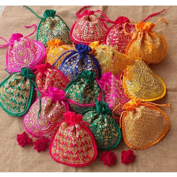 Shree Shyam Products - WEDDING RETURN GIFT BAGS.EMBROIDERED GIFT BAGS  Embroidered Wedding gift bag is made on soft velvet and silk fabric with  designer style embroidery adorned on the front. Embroidery bag