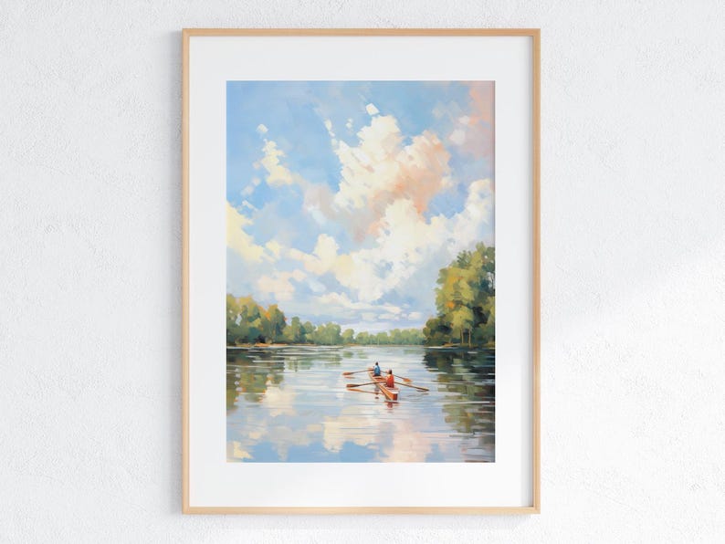 May include: A framed art print featuring a serene landscape painting. The artwork depicts a boat with two figures rowing on a calm lake, reflecting the sky and clouds. The sky is a mix of blue, white, and peach hues, with green trees lining the distant shore.