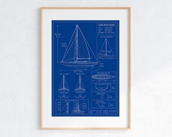 May include: A framed blueprint of a classic wooden sailboat featuring white technical line drawings on a deep blue background. The print displays various views including side, front, and rear elevations, deck layout, and keel profile with measurements in feet.