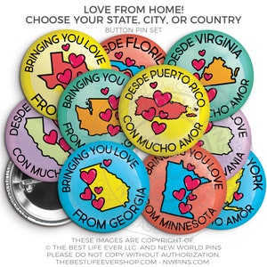 May include: A set of 10 button badges featuring different states and territories of the United States. Each badge has a colourful watercolour background with a state outline and hearts. The text on the badges reads "Bringing You Love From [State Name]" or "Desde [State Name] Con Mucho Amor".