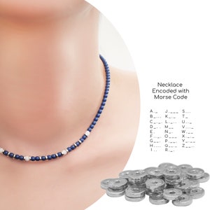May include: A necklace made of blue and white beads with silver spacers. The necklace is on a model's neck. The image also shows a pile of silver beads.