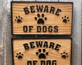 Beware of Dog(s) sign. Hang outdoors or indoors. Handmade weather-resistant wood sign alerts visitors to your pets. Use for security or fun.
