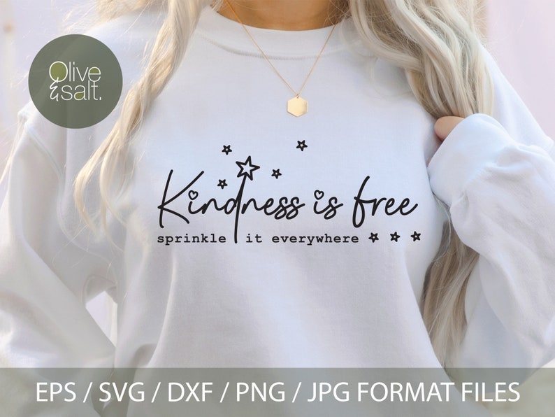 May include: White sweatshirt with the text "Kindness is free sprinkle it everywhere" in black lettering with a small heart and stars.