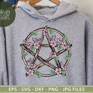 May include: A gray hoodie with a pentagram design featuring a five-pointed star surrounded by pink flowers and green leaves. The text "Olive & Salt." is visible in the top left corner of the image.
