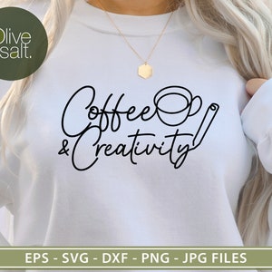 May include: White sweatshirt with the text "Coffee & Creativity" in black script font. A stylized coffee cup and a pencil are included in the design.