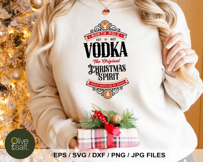 May include: A white sweatshirt with a red and black graphic design that says "North Pole Vodka The Original Christmas Spirit Triple Distilled by Elves".