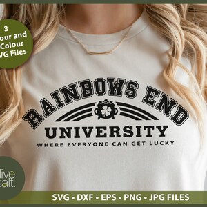 May include: A white t-shirt with a black graphic that says "Rainbows End University" with a pot of gold and a shamrock underneath. The text below the graphic says "Where everyone can get lucky".