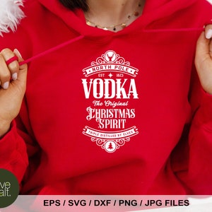 May include: Red hoodie with a white graphic design that says "North Pole Est. 1823 Vodka The Original Christmas Spirit Triple Distilled by Elves".