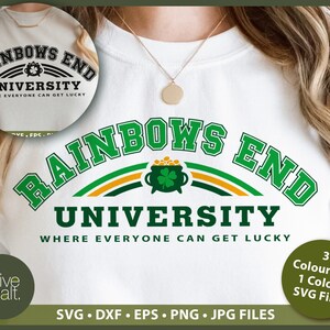 May include: A white t-shirt with a green, yellow, and gold graphic that says "Rainbows End University Where Everyone Can Get Lucky".
