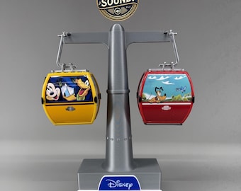 Support pour le Disney Skyliner : Système audio intégré et batterie rechargeable. Cabines non incluses !