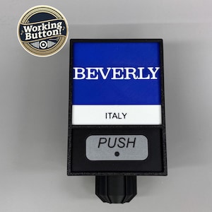 May include: A black and blue push button with the word "BEVERLY" and "ITALY" printed on it. The button also has the word "PUSH" on it. A round sticker with the words "Working Button!" is in the upper left corner.