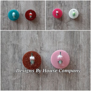 May include: Five different color resin phone grips with a miniature Starbucks cup design. The colors are teal, red, pink, white, and brown.