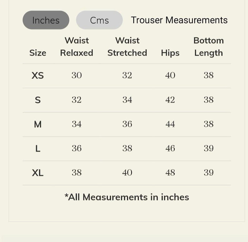 May include: A white chart displays trouser measurements in inches. Sizes XS to XL are listed with waist relaxed, waist stretched, hips, and bottom length measurements. The chart includes the text "All Measurements in inches."