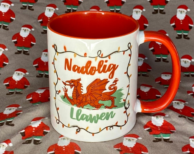 Mwg Nadolig Llawen a’r fanner Cymru / Nadolig Llawen(Merry Christmas) mug with the Welsh flag. Can be personalised