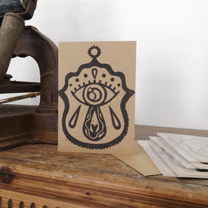 Carte oeil ex-voto linogravure