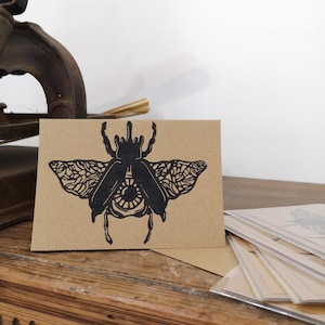 Carte scarabée illustration linogravure