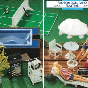 May include: A plastic canvas dollhouse patio set with a pool, grill, lounge chair, table and chairs, and a doll. The set is decorated with a white umbrella and a green lawn. "FASHION DOLL PATIO" PLAYTIME is written on the top of the image.
