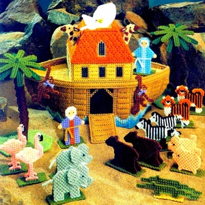 May include: A plastic canvas craft kit depicting Noah's Ark with various animals, including a giraffe, zebra, elephant, tiger, flamingo, and alligator. The ark is brown with a yellow roof and a blue waterline. The animals are all different colors and are standing on green bases.