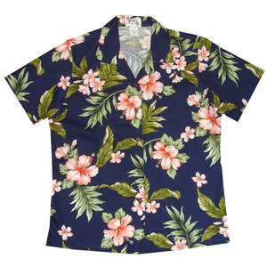 May include: A navy blue short-sleeved shirt with a floral print featuring pink hibiscus flowers and green leaves.