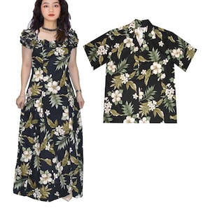 May include: A black and white floral print dress and matching shirt. The dress has a ruffled neckline and short sleeves. The shirt has a button-up front and short sleeves.